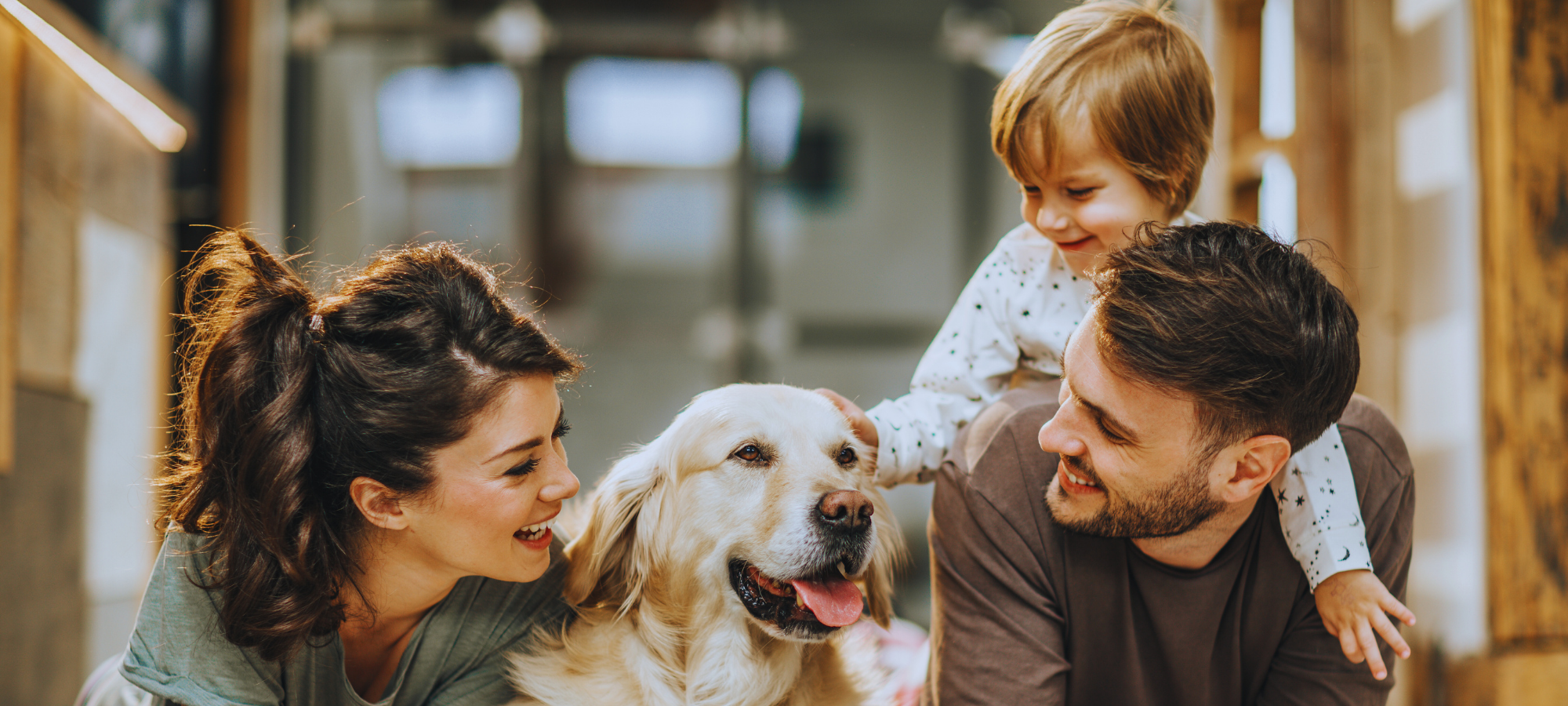 Family at home enjoying time together with their dog.
